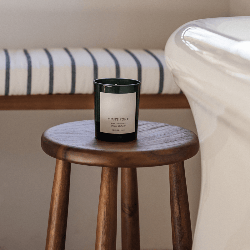 Mont Fort scented candle on a wooden stool