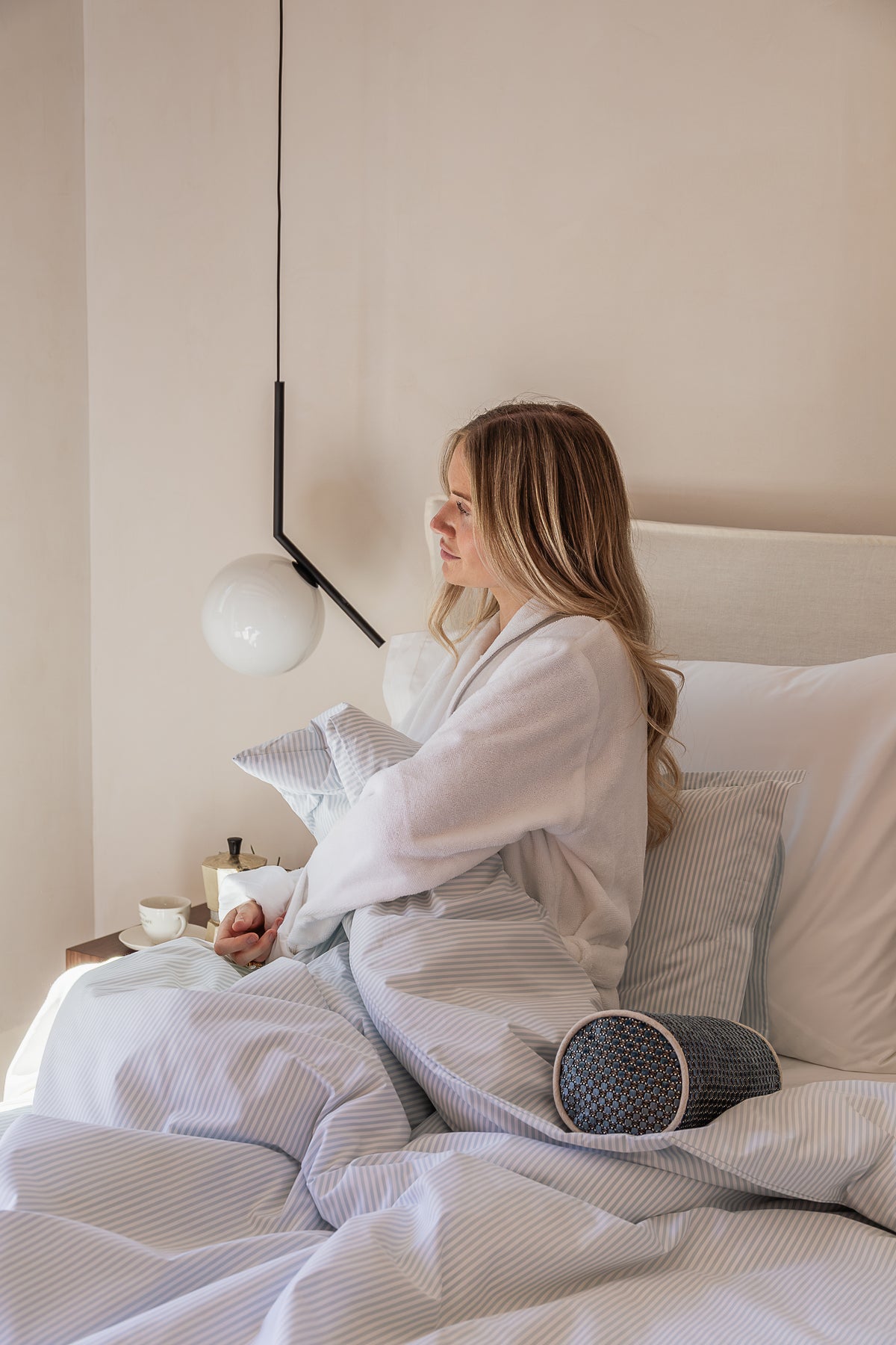A quiet morning in bed, wrapped in a robe
