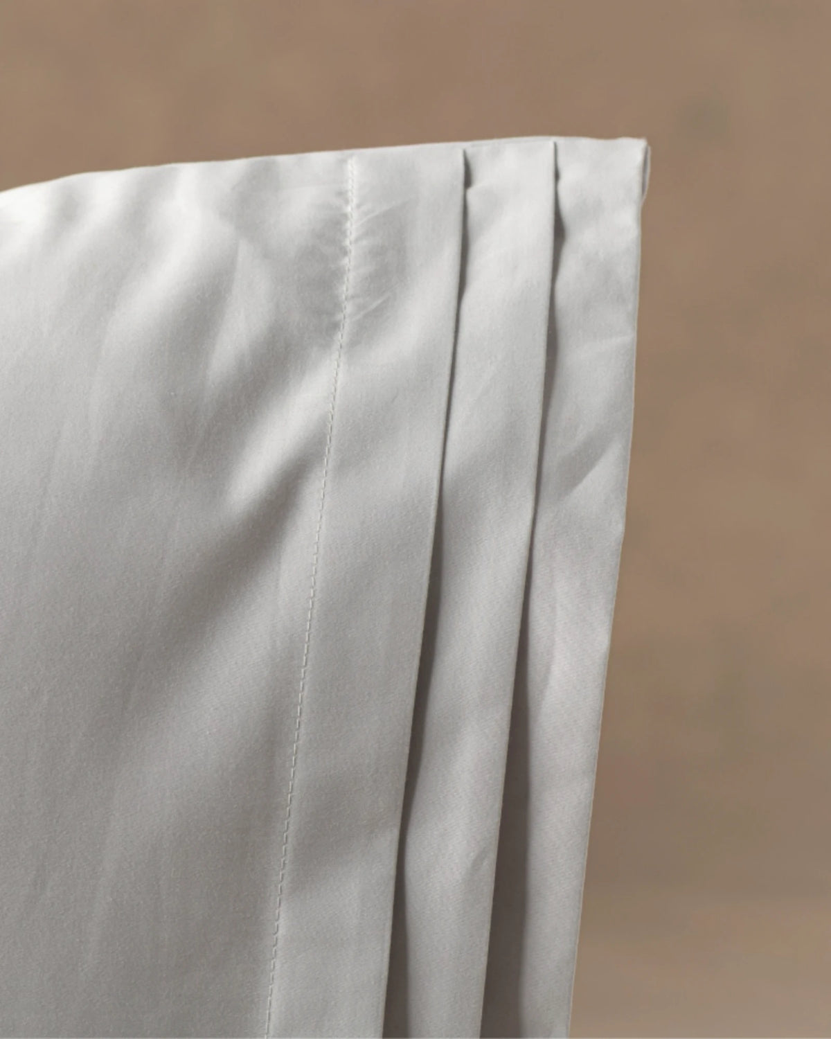 Tailored pleats, hidden closures